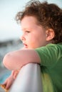 Young toddler girl on patio deck outside at sunset down at shore