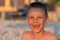 Young toothless boy at the beach Royalty Free Stock Photo