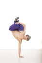 Young topless male dancer sitting on one hand Royalty Free Stock Photo