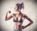 Young tough woman with tattoos