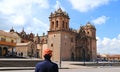 Young Tourist Admiring the Marvelous Cusco Cathedral on Plaza de Armas, Cusco, Peru