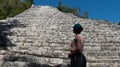 Young tourist admiring the Mayan pyramid of Nohoch Mul, located in the ancient Mayan city of Coba, ideal place for vacation and Royalty Free Stock Photo