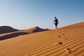 Tourist in desert Royalty Free Stock Photo