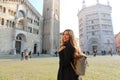 Young tourist backpacker visiting Parma city in Italy on spring time. Parma city is the Italian Capital of Culture 2020