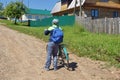 young tourist boy on a Bicycle travelling stopped looking forwar