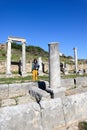 Young tourist boy with the camera on the ruins of ancient city Perge near Antalya, Turkey Royalty Free Stock Photo