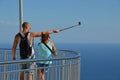 Young tourist couple capturing a selfie in a panorama point