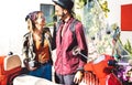 Young tourist couple having fun together at scooter moped ride - Hipster guy having fun outdoors Royalty Free Stock Photo