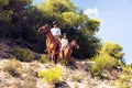 Young Tourist Couple Horseback Riding Royalty Free Stock Photo