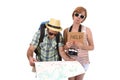 Young tourist couple reading city map looking lost and confused loosing orientation with girl carrying travel backpack Royalty Free Stock Photo