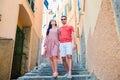 Young tourist couple traveling on european holidays outdoors in italian vacation in Cinque Terre