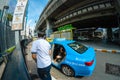 Young tourist gets out of taxi cab, Bangkok