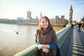 Young tourist in London on Westminster bridge