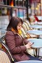 Young tourist in Paris sending sms Royalty Free Stock Photo