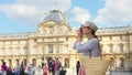 Young tourist with a retro camera in Paris