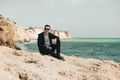 Man sitting on the stone. Travel concept Royalty Free Stock Photo