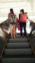 Young tourist on subway escalator