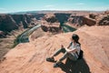 Lady holding cellphone sightseeing the view Royalty Free Stock Photo