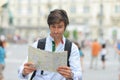 Young tourist watching the map