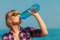 Young woman drinking water outdoor Royalty Free Stock Photo