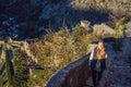 Young tourist woman enjoying a view of Kotor Bay, Montenegro. Kotor Old Town Ladder of Kotor Fortress Hiking Trail Royalty Free Stock Photo