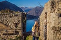 Young tourist woman enjoying a view of Kotor Bay, Montenegro. Kotor Old Town Ladder of Kotor Fortress Hiking Trail Royalty Free Stock Photo
