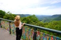 Young tourist woman enjoying view of Serra Gaucha from Gramado town, Rio Grande do Sul, Brazil Royalty Free Stock Photo