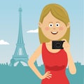 Young tourist woman with film camera stands in Paris in front of Eiffel tower Royalty Free Stock Photo