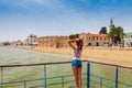 Young tourist woman looking at medieval castle in Larnaca,Cyprus. Famous tourist destination Royalty Free Stock Photo