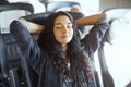 Young tourist woman traveling sitting in the train. Royalty Free Stock Photo