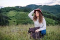 Young tourist woman traveller with backpack in nature, resting. Royalty Free Stock Photo