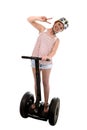 Young tourist woman wearing safety helmet doing peace hands sign smiling happy riding electrical segway