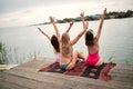 Young tourist women have fun on the dock on lake Royalty Free Stock Photo