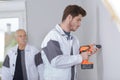 Young tradesman using cordless drill Royalty Free Stock Photo