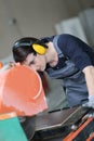 Young trainee in professional training using tile grinder