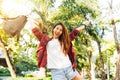 Young traveler asian woman admiring beautiful sunny narrow streets in Bangkok, Thailand. Sunny day in Bangkok, traveling in Asia. Royalty Free Stock Photo