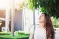 Young traveler asian woman admiring beautiful sunny narrow streets in Bangkok, Thailand. Sunny day in Bangkok, traveling in Asia. Royalty Free Stock Photo