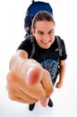 Young traveler with bag pack pointing at camera Royalty Free Stock Photo