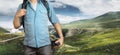 Young Traveler Blogger Man With Backpack And Film Camera In Mountains. Hiking Tourism Journey Concept Royalty Free Stock Photo