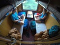 Young traveler couple looking through the window while riding on sleeper train.