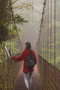 Young traveler hiking in Monteverde Cloud forest with a practical Fjallraven Kanken backpak. Royalty Free Stock Photo