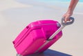 Young traveler with his luggage on a tropical beach Royalty Free Stock Photo