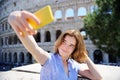 Young traveler making selfie photo standing the Colosseum in Rome Royalty Free Stock Photo