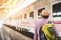 Young traveler man at platform train station. Traveling concept Royalty Free Stock Photo