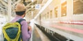 Young traveler man at platform train station. Traveling concept Royalty Free Stock Photo