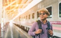 Young traveler man at platform train station. Traveling concept Royalty Free Stock Photo