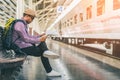 Young traveler man at platform train station. Traveling concept Royalty Free Stock Photo