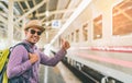 Young traveler man at platform train station. Traveling concept Royalty Free Stock Photo