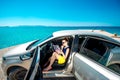 Young traveler with map sitting in the car Royalty Free Stock Photo