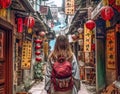 Young traveler woman alone in a narrow alley trying orientate. Travel concept